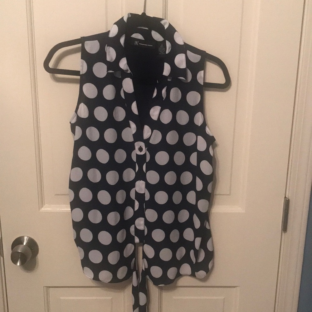 Blue with white dots sleeveless tie bottom top.